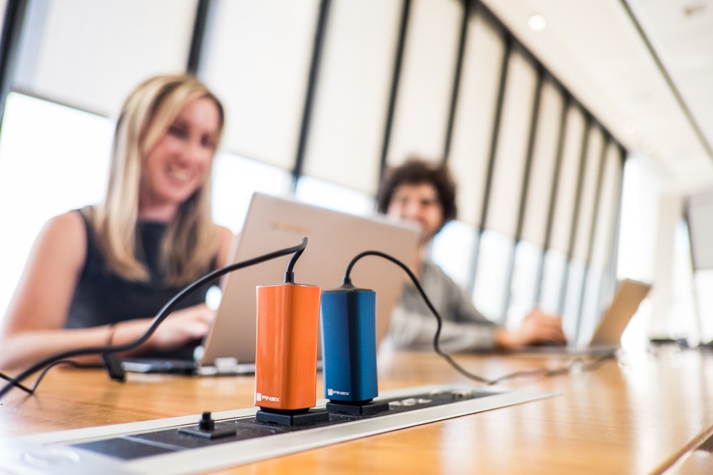 Four times smaller and six times lighter than today’s laptop adapters, the FINsix Dart is a full-powered 65W AC adapter that also features a built-in 2.1 amp USB port for simultaneously charging phones and tablets. (Photo: FINsix/BusinessWire)
