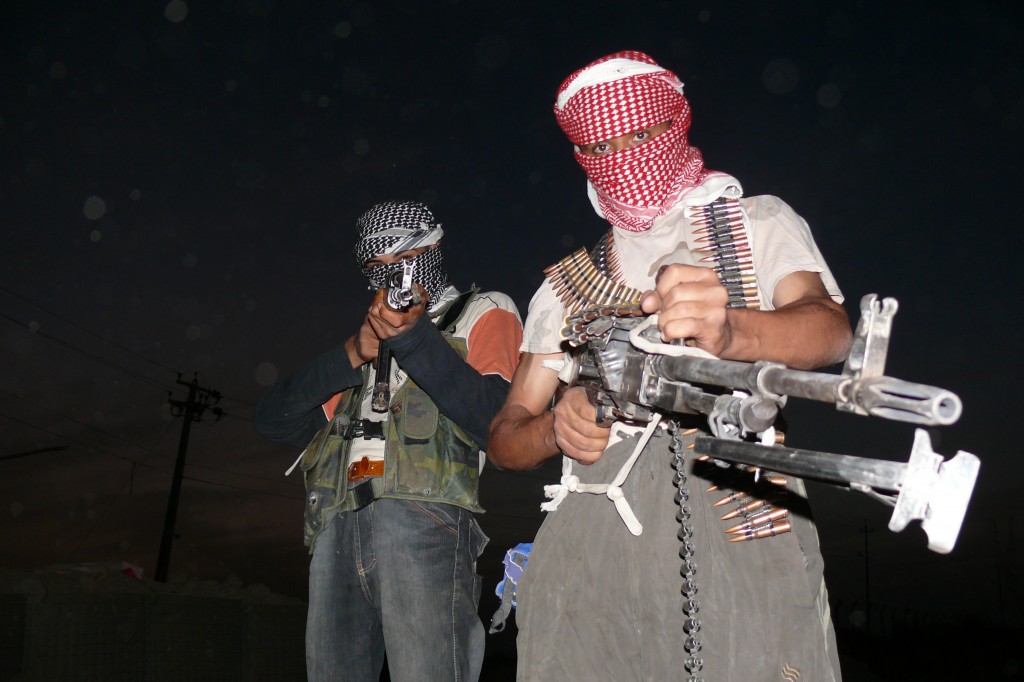 A pair of armed anti-American insurgents in Iraq (image courtesy of Wikimedia Commons)