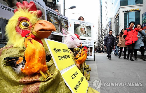 Animal-Masked Activists Campaign for Lower Meat Consumption amidst Mass Culls
