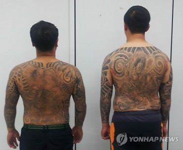 Police Fines Two Gangsters for Displaying Their Tattoos
