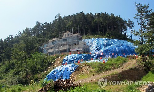 There are worries about reckless development. Soil erosion on the hills nearby the construction site is drawing concern. (Image : Yonhap)