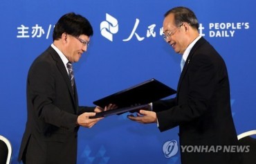 Yonhap News, People’s Daily Agree on Promoting News Cooperation