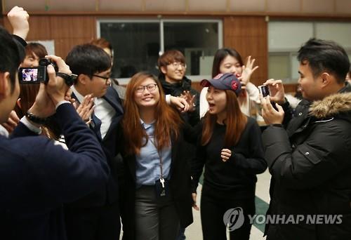 This photo released by the student magazine Seoul National University Journal shows the newly elected student president Kim Bo-mi (C) receiving congratulations from her supporters on Nov. 19, 2015. (Image : Yonhap)