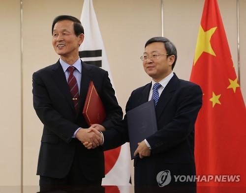 A free trade agreement between South Korea and China will come into force on Dec. 20, officials said Wednesday, about six months after the two nations formally signed the deal aimed at slashing tariffs and other trade barriers. (Image : Yonhap)