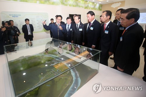 A ribbon cutting ceremony was held to celebrate the completion of Hongcheon Eco-friendly Energy Town, which is composed of unwanted public facilities such as manure treatment plants. (Image : Yonhap)
