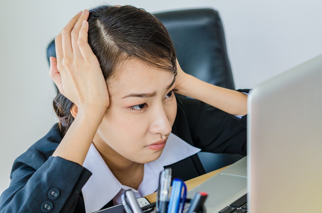 Survey data reveals that office workers are stressed because of English, even if they are not required to use the language frequently. (Image : Shutterstock)