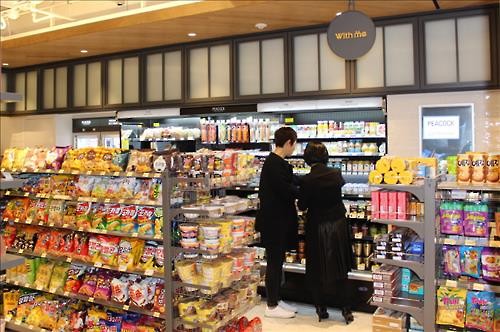 With Me, the convenience store managed by Shinsegae group, announced that they opened a new store in the SUM Market located in the Samsung-dong building of SM Entertainment. (Image : SM Entertainment)