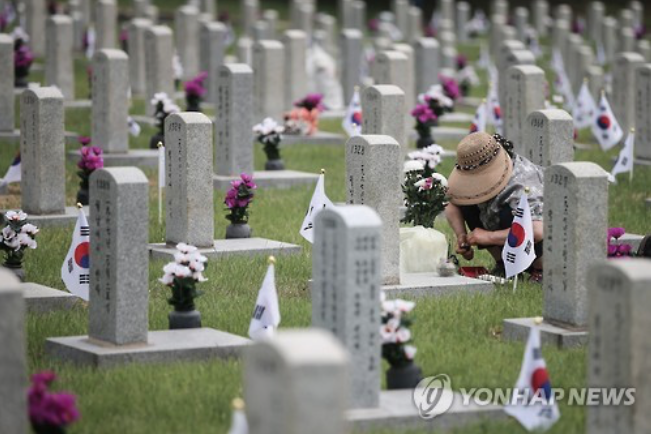 A visitor honors the fallen soldier of the Vietnam War at  Seoul National Cemetery.