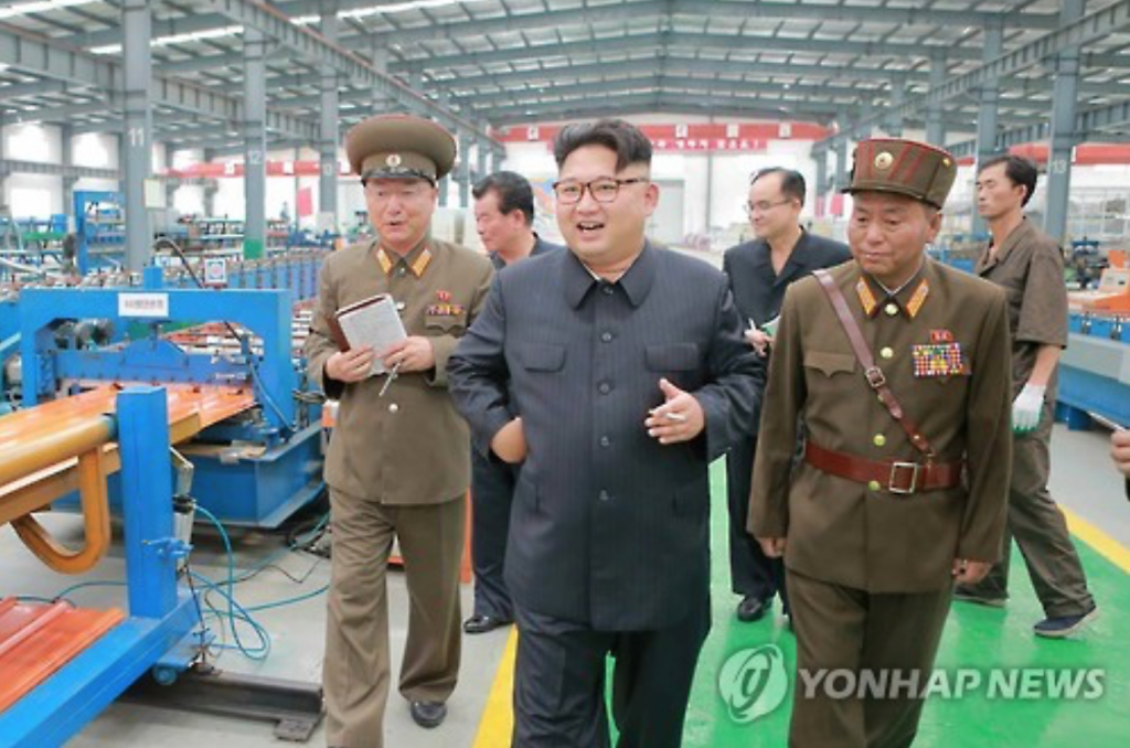 North Korea's top leader Kim Jong-un (C) tours the Chollima Building Materials Complex in this photo released by the North's state-run Rodong Sinmun newspaper on July 27, 2016.