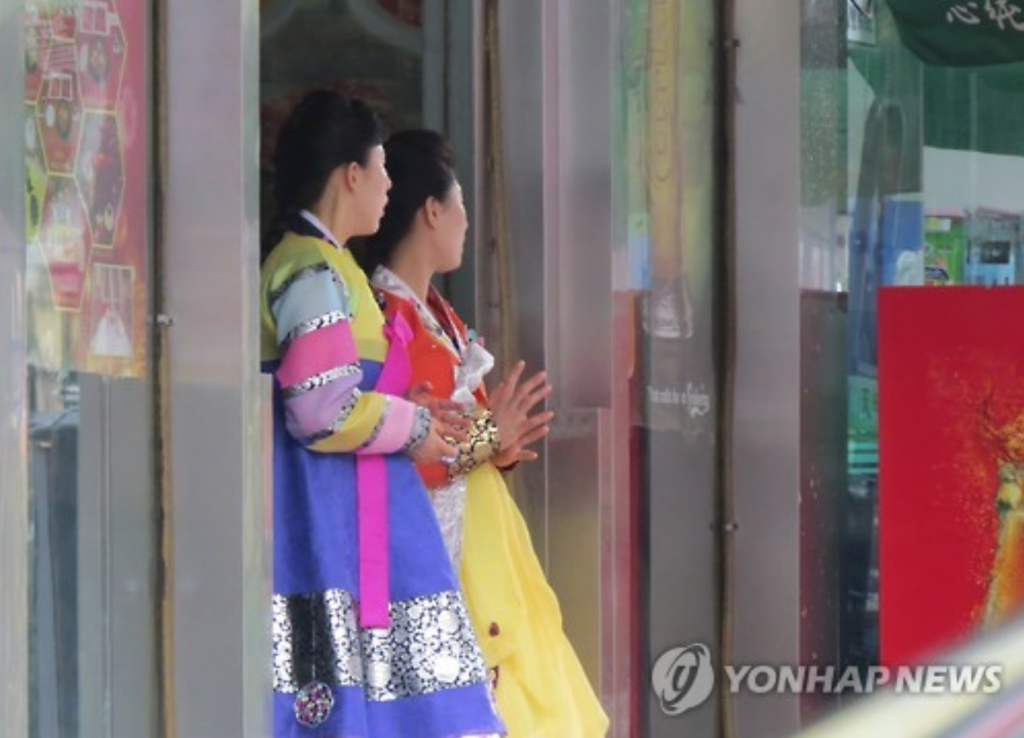 Female employees are on standby in front of the door of a North Korean restaurant at a Koreatown in the northeastern Chinese border city of Shenyang on Aug. 19, 2016. Asked on whether they know of the latest defection of Thae Young-ho, a minister at the North Korean Embassy in London, to South Korea, they repeatedly answered in unison that they were unaware of it. (image: Yonhap)