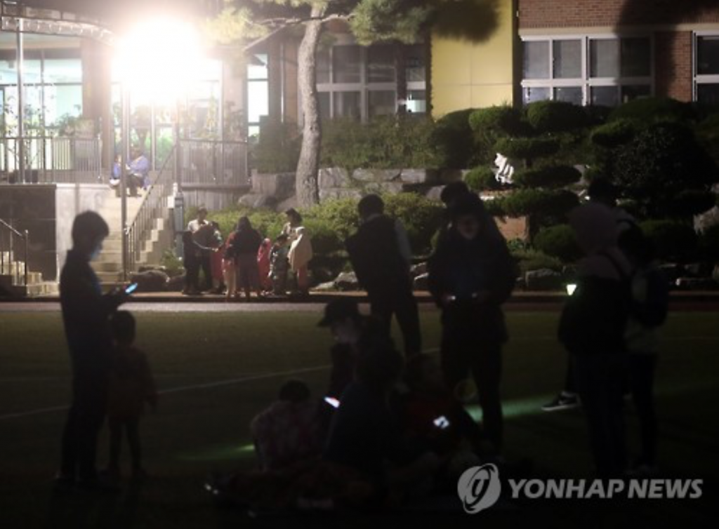 Residents in Ulsan evacuated to a local elementary school playground after Monday’s aftershock, which was also felt in the city.