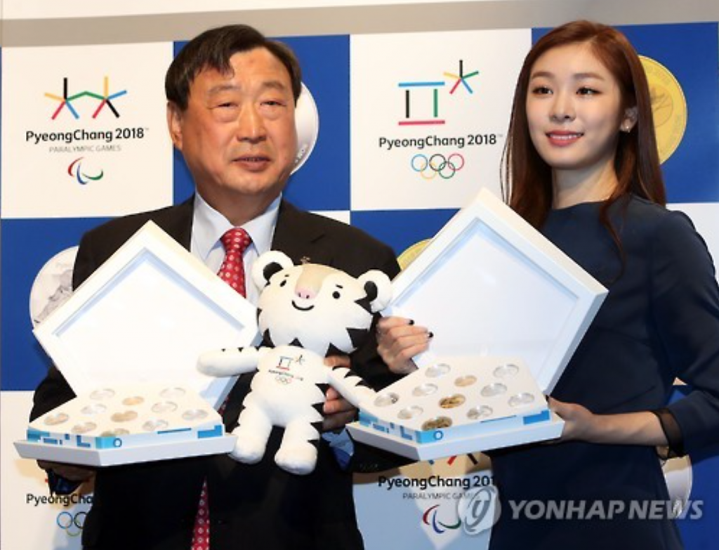 PyeongChang 2018 Committee President Lee Hee-beom (L) with honorary ambassador and former figure skater Kim Yu-na.