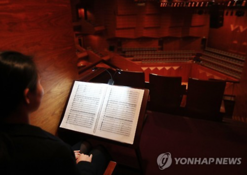 Concert Hall Offers Seat with No Stage View, Only Sheet Music