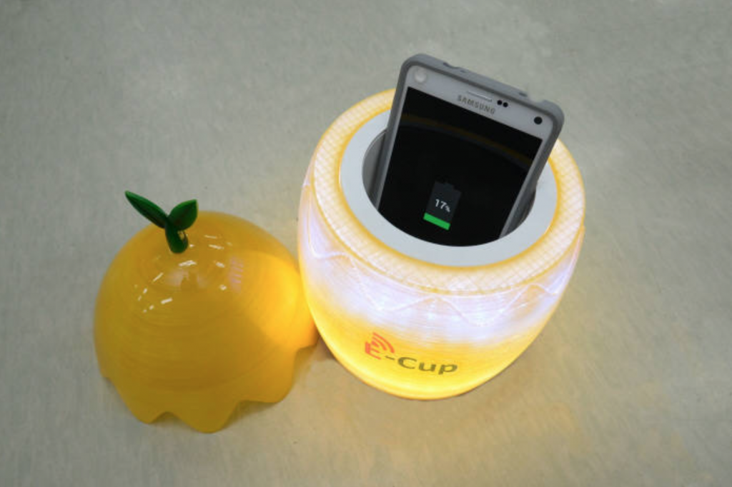 The charger developed by the institute maintains stable charging efficiency as long as the smartphone (or smartphones) sits inside the 10-centimeter wide cup. (image: ETRI)