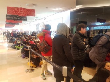 Olympics Goose Down Jacket Sells Out Once Again as Customers Line Up Overnight