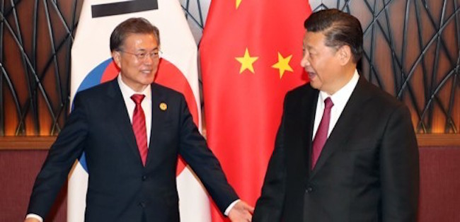 Moon sat down for a face-to-face with China's leader Xi Jinping in Vietnam on November 11, the first time the two had spoken since July due to frustrations from Beijing over the installation of U.S. THAAD missile systems on the peninsula. (Image: Yonhap)