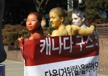 PETA Activists in Body Paint Stage Protest Against Canada Goose Jackets