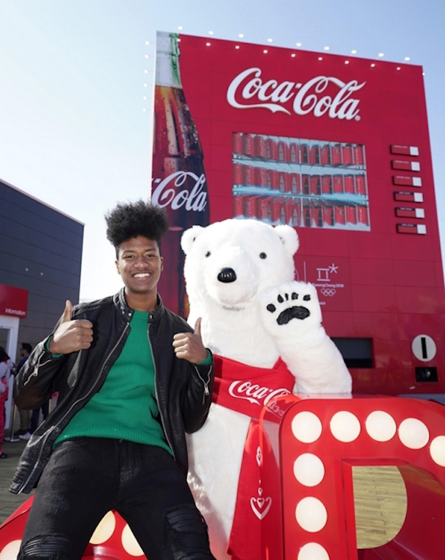 Born to a Nigerian father and a Korean mother, the dark-skinned Han Hyun-min has earned the informal title of “South Korea's first black model”, and was named to Time Magazine's “The 30 Most Influential Teens of 2017”. (Image: Coca-Cola)