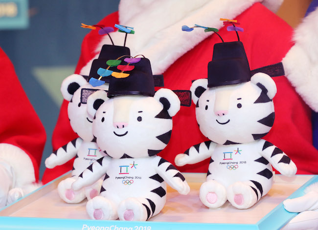 "Soohorang," the mascot for the 2018 PyeongChang Winter Olympics, is cuddled by Olympic winners on the podium after their events, receiving as much media attention as victorious athletes. (Image: Yonhap)