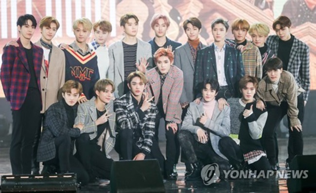 Boy band NCT pose for photos at a media showcase for its album, "NCT 2018 Empathy," at Korea University's Hwajung Gymnasium in Seoul on March 14, 2018. (Image: Yonhap)