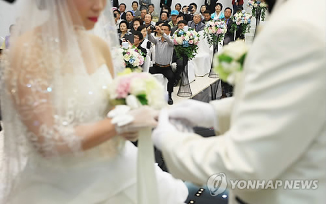 In more good news for international marriages, divorces fell by 7 percent to 7,100. (Image: Yonhap)