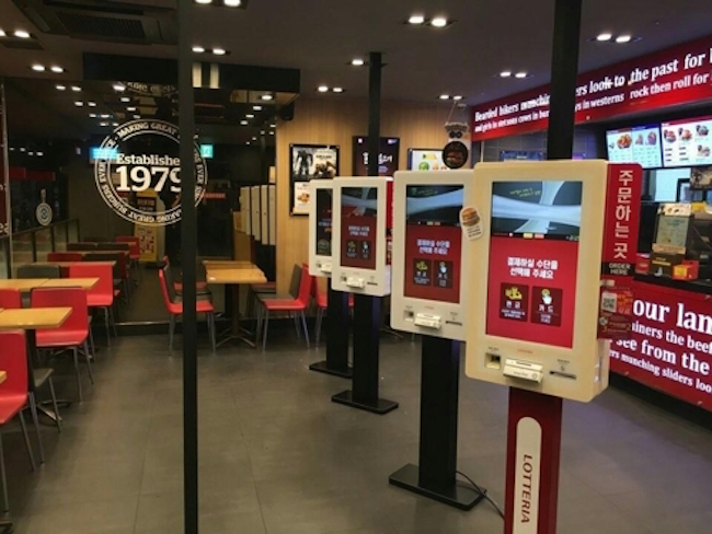 Across the fast food industry, where self-service is a given, Lotteria, Burger King and McDonald's have placed ordering kiosks in over 30 percent of their respective franchises, with the eventual goal of putting one in every store. (Image: Lotteria)