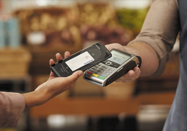 This image provided by Samsung Electronics Co. shows the use of its digital payment service Samsung Pay. 