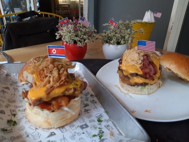 N. Korean Reporter Content with ‘Summit Burgers’ in Hanoi