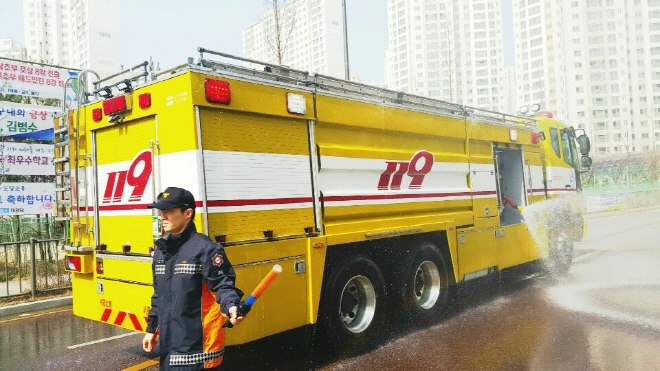 Fire Trucks Water City Streets to Prevent Dust