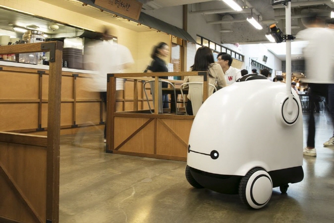Shown in the file photo provided by Woowa Brothers Corp. is an image of an autonomous delivery robot named Dilly.