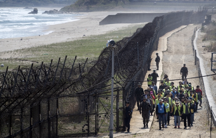 Civilian hikers walk along the Goseong DMZ Peace Trail in Goseong, Gangwon Province, on April 27, 2019. (Yonhap)