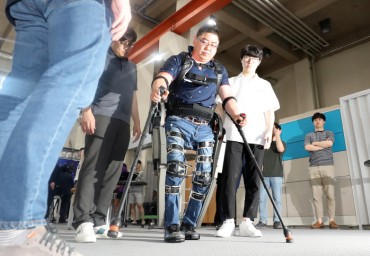 Wearable Robots to Help Persons with Disabilities