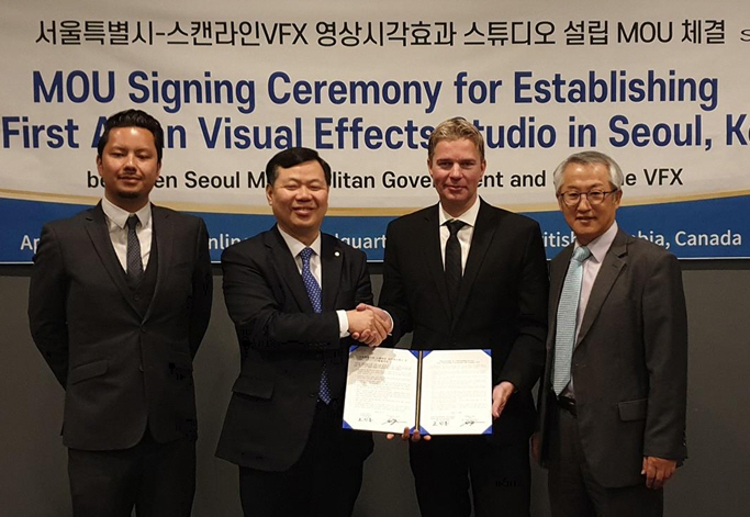 Cho In-dong (2nd from L), head of the economic policy bureau at the Seoul metropolitan government, shakes hands with Scanline VFX President Stephan Trojansky during a ceremony in Vancouver on April 11, 2019, to establish Scanline's studio in Seoul. (image: Seoul Metropolitan Government)