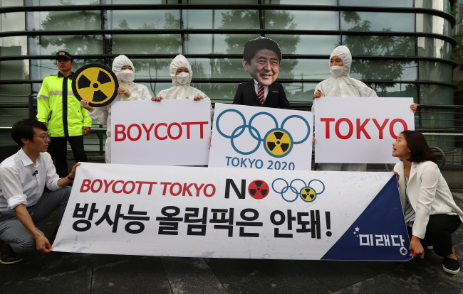 A group of activists stages a campaign to boycott the 2020 Tokyo Olympics while calling it the "Radioactive Olympics" in front of the Japanese Embassy in Seoul on Aug. 7, 2019. (Yonhap)