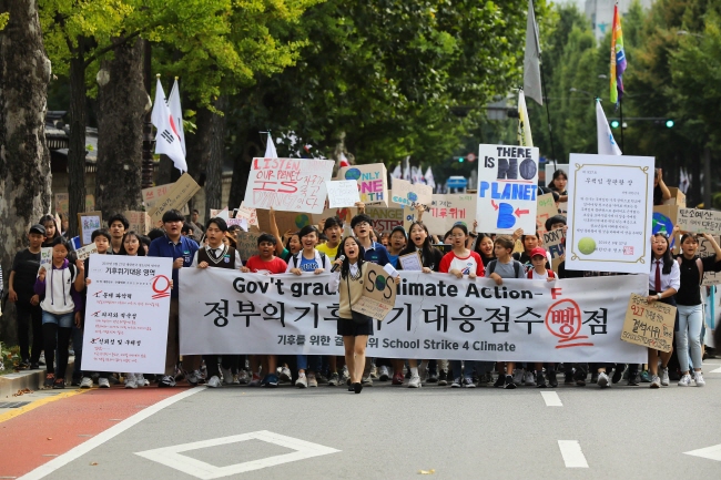 This image provided by the Youth 4 Climate Action shows students marching to the presidential office as part of the youth climate strike on Sept. 27, 2019.