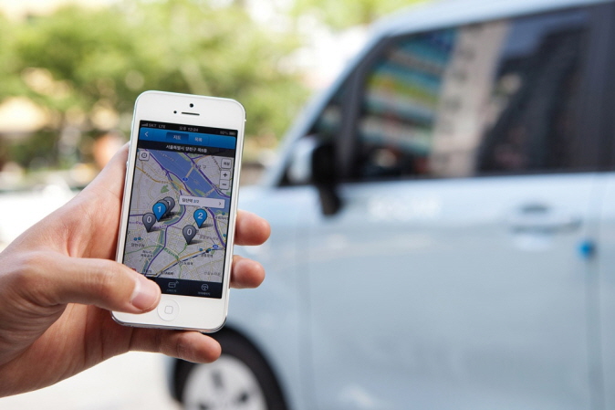 The SOCAR app is seen in this photo provided by the car-sharing company. 