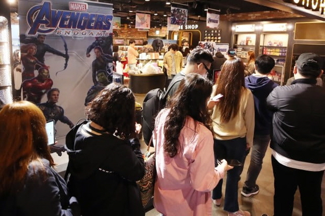 People wait in line to see the Marvel film "Avengers: Endgame" on the first day of its opening at a Seoul theater on April 24, 2019. (Yonhap)
