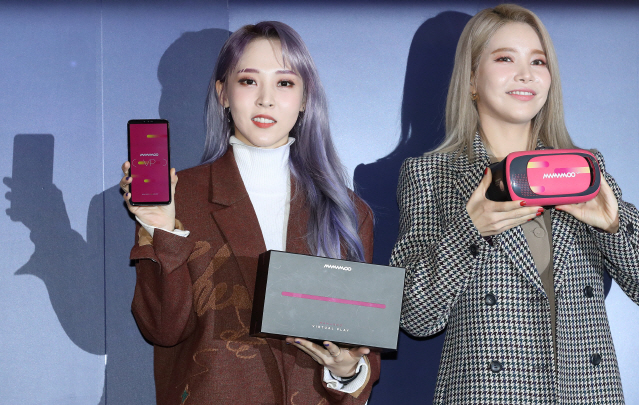 Mamamoo members pose with Genie Music's first Virtual Play product featuring the K-pop girl band on Dec. 10, 2019. (Yonhap)