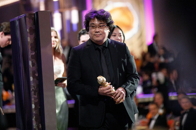 South Korean director Bong Joon-ho holds his Golden Globe after winning the best foreign language film prize with "Parasite" at the 77th Annual Golden Globe Awards at the Beverly Hilton Hotel in Beverly Hills, California, on Jan. 5, 2020. (image: CJ ENM)