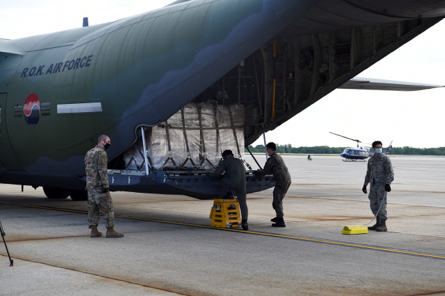 This photo, provided by the South Korean Embassy in Washington, shows a cargo of 500,000 face masks being unloaded at Joint Base Andrews, Maryland, on May 12, 2020. 