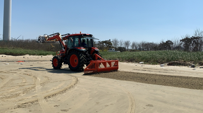 Farm Tractors Transformed into Marine Debris Collectors