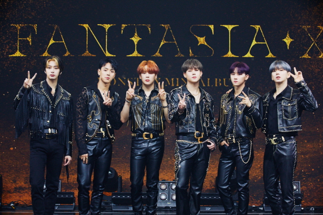 This photo provided by Starship Entertainment shows boy band Monsta X posing for photos during a media showcase for the group's new EP record, "Fantasia X," held in Seoul on May 26, 2020.