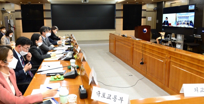 This photo, provided by Seoul's foreign ministry, captures a videoconference between government officials of South Korea and Chinese that took place on April 29, 2020, to finalize the agreement for a fast-track entry system for businesspeople in exception to entry curbs imposed due to the coronavirus outbreak.
