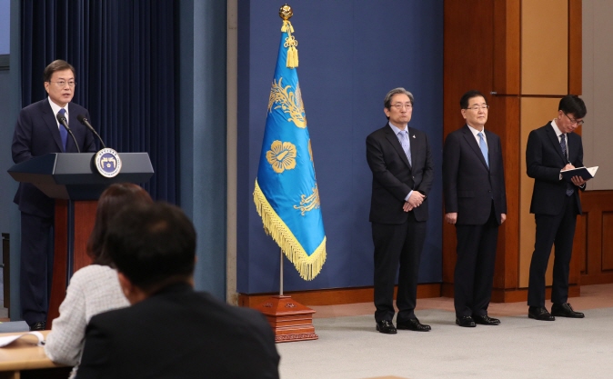 President Moon Jae-in (L) delivers a special address at the Cheong Wa Dae press briefing room on May 10, 2020, the third anniversary of his inauguration. (Yonhap)