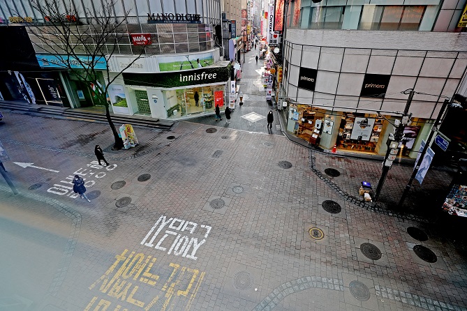The file photo, taken Feb. 29, 2020, shows nearly empty streets in Myeongdong, one of the most popular shopping districts in Seoul, amid a sharp increase in online sales caused by the outbreak of the new coronavirus. (Yonhap)