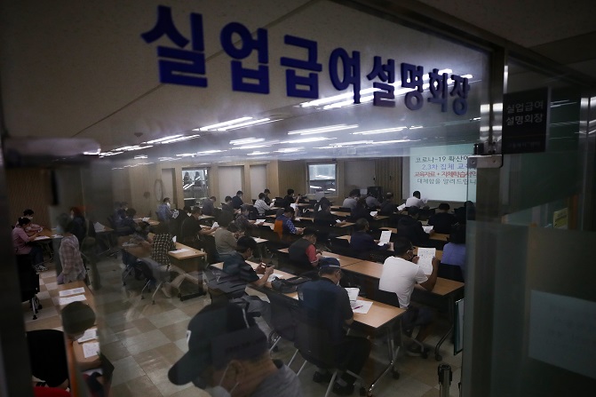 This photo, taken on June 10, 2020, shows people attending an orientation on unemployment benefits at an employment help center in central Seoul. (Yonhap)