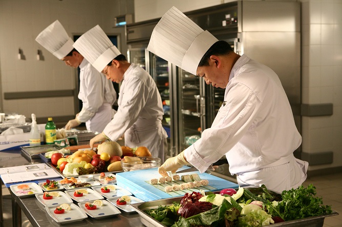 This undated file photo, provided by Korean Air, shows chefs preparing in-flight meals at the Korean Air Catering Center in Incheon, just west of Seoul.