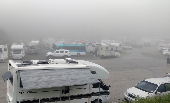 Camping vans are parked on a road near the Daegwallyeong Service Area in Gangwon Province. (Yonhap)