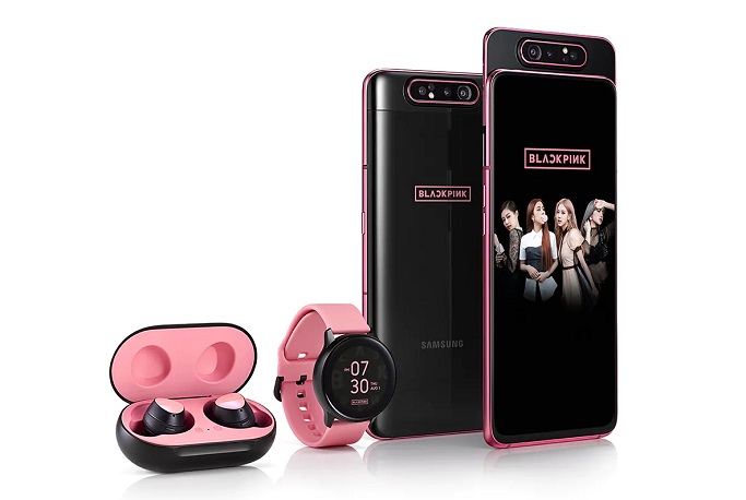 This image provided by Samsung Electronics Co. shows the company's Galaxy A80 smartphone, Galaxy Watch and Galaxy Buds products inspired by K-pop girl group BLACKPINK.