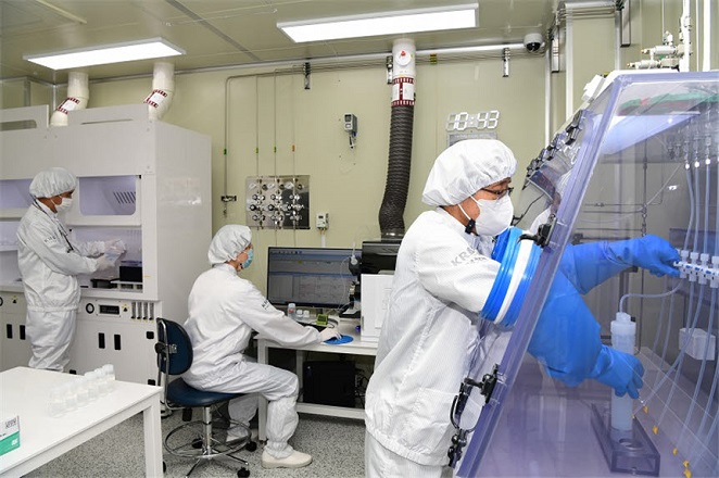 This file photo, provided by the Korea Research Institute of Standards and Science on Sept. 22, 2020, shows researchers carrying out a quality evaluation of hydrogen fluoride. 